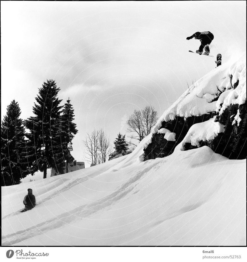 A mess! Winter Snowboard Winter sports White Jump Rock Sports Snowboarder Snowboarding Freestyle Powder snow Deep snow Departure Brave Ledge Black & white photo