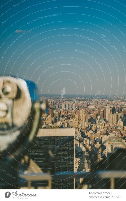 Viewpoint on city with binocular viewpoint observe platform cloudless blue sky skyscraper megapolis downtown new york usa united states america tourism public