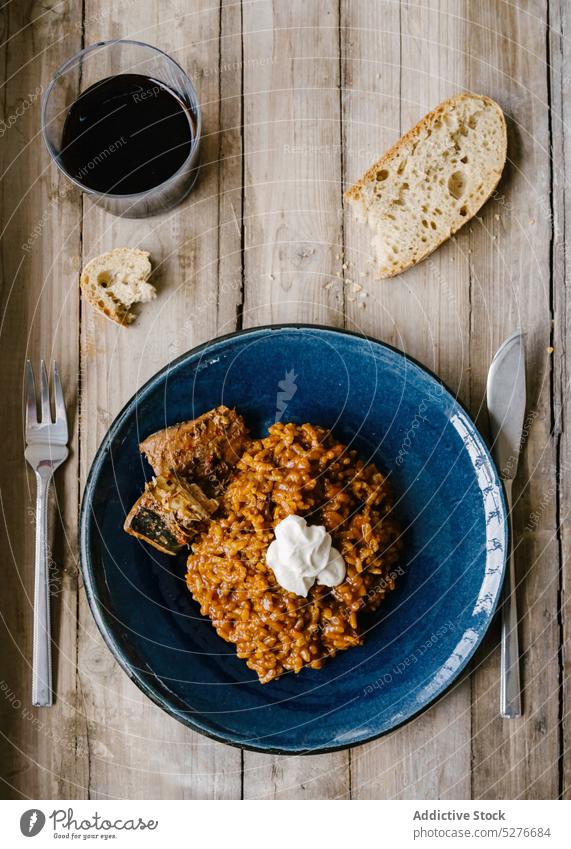 Tasty homemade Spanish dish on plate fish food seafood rice oil serve meal cook cuisine tradition dinner delicious culinary table typical gourmet tasty lunch