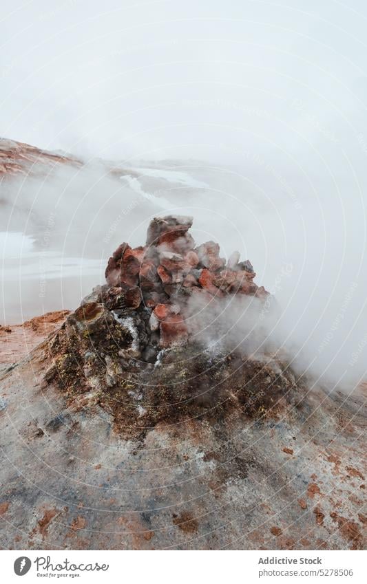 Stone pile over steam vent stone emit volcanic geothermal valley terrain gray iceland hverir heat heap formation nature rock energy climate spectacular hot dull