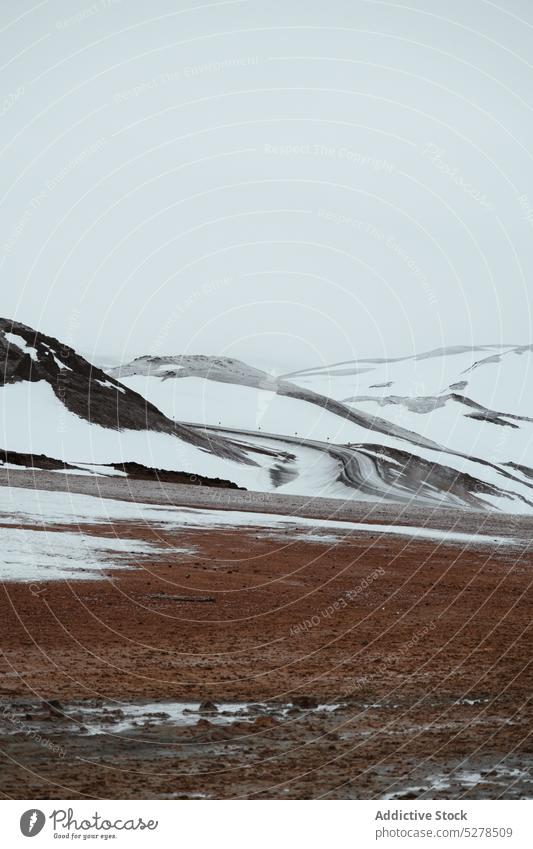 Snowy valley and hills on gray day snow frozen sky cold winter countryside weather iceland terrain season nature frost dull climate ridge range mountain scenic