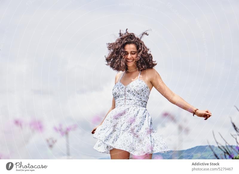 Cheerful woman dancing in field dance park smile summer happy countryside enjoy grass lawn rest female young cheerful sun relax carefree nature daytime positive