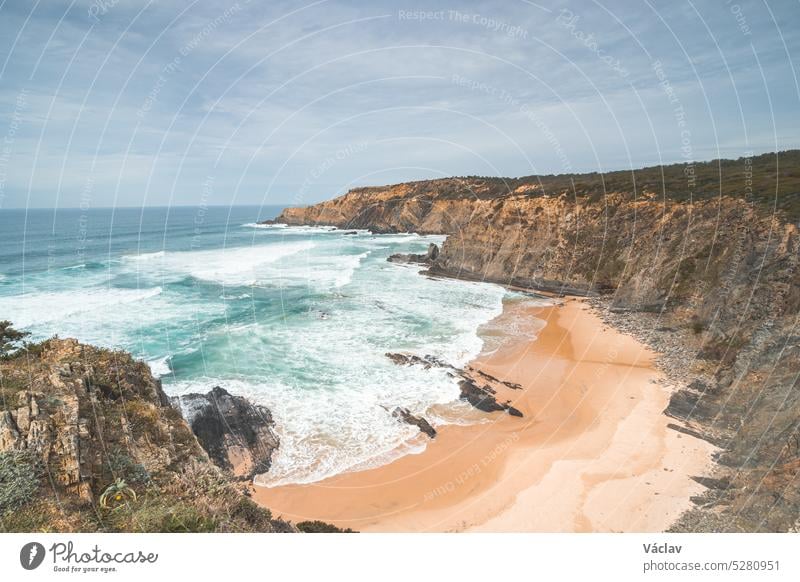 Rugged, unique rock and cliff coastline on the Atlantic Ocean in the west of Portugal in the famous tourist region of the Algarve. In the footsteps of the Fisherman Trail