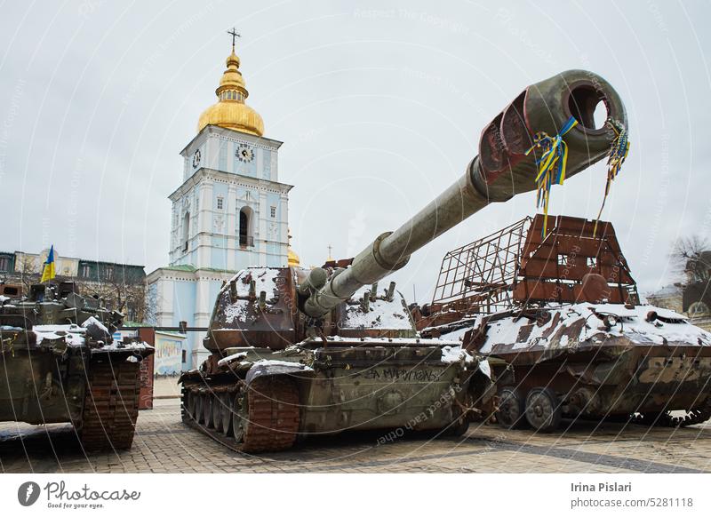 Kyiv, Ukraine - 03.29.2023: Civilian car shot by Russian soldiers. War in Ukraine. Destroyed russian tank on the Mykhailivs'ka Square. accident aggression