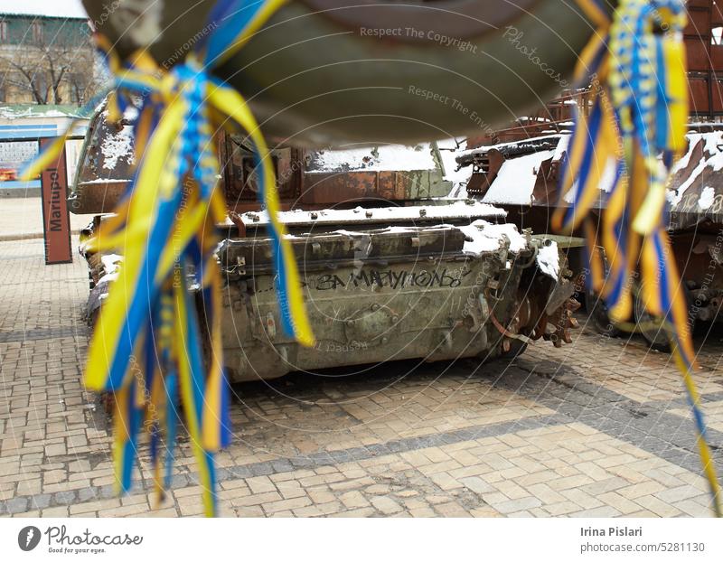 Kyiv, Ukraine - 03.29.2023: Civilian car shot by Russian soldiers. War in Ukraine. Destroyed russian tank on the Mykhailivs'ka Square. accident aggression