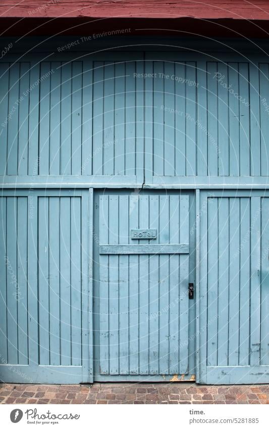 MainFux | Back Entrance door Goal Blue Wood rear entrance paving roofed Hotel Hostel Tourism Accommodation roof overhang Old mightily damaged worn-out