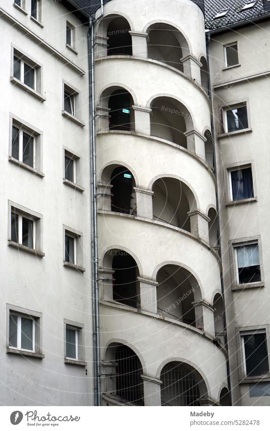 Exterior staircase of the former warehouse and art center ATELIERFRANKFURT in beige and natural colors with round arches at Hanauer Landstraße in the Ostend of Frankfurt am Main in Hesse, Germany