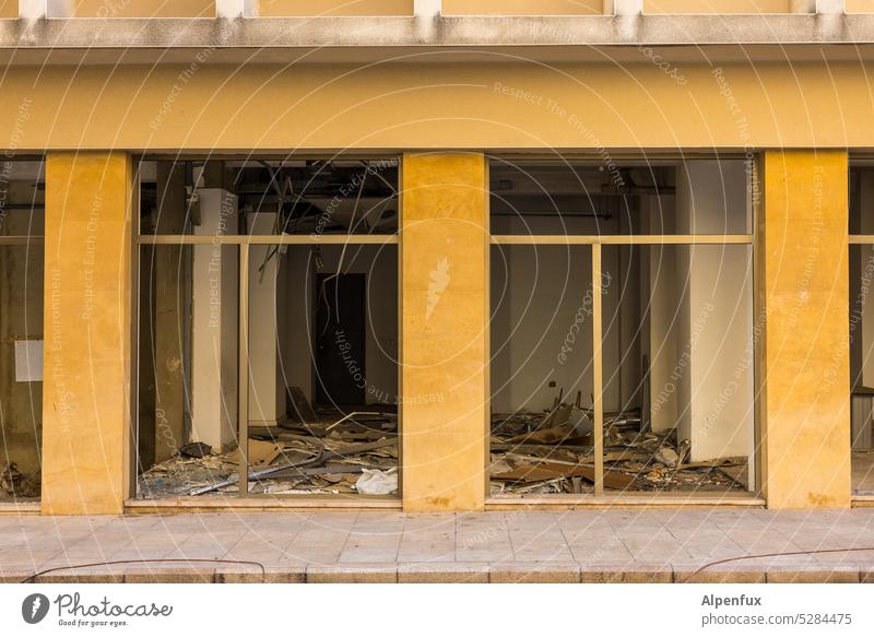 Damage Store premises demolished rampage Vandalism Destruction Shop window Facade Trade Closed Window Broken Deserted business Building Vacancy Retail sector