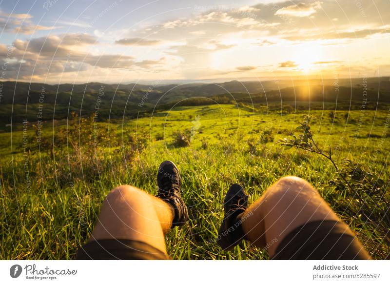 Man admiring view during sunset man traveler picturesque landscape sundown meadow grass admire costa rica male nature summer tourism trip vacation adventure