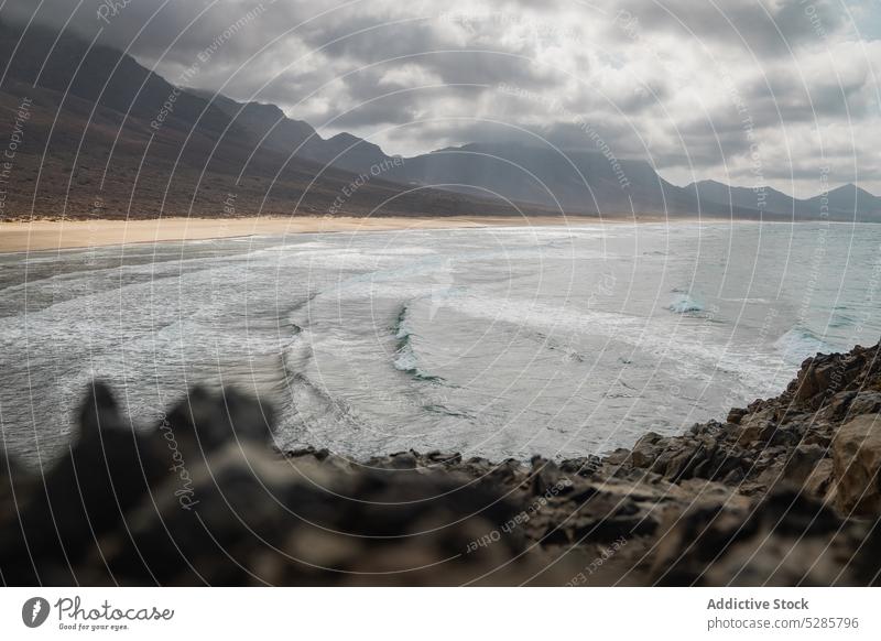 Amazing view of mountains near sea sand beach freedom picturesque tourism water nature seascape ocean journey countryside trip wave foam sky shore scenic