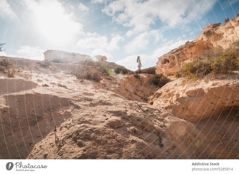 Unrecognizable traveler standing on cliff woman admire mountain edge nature rock vacation trip tourism landscape adventure journey picturesque scenery relax