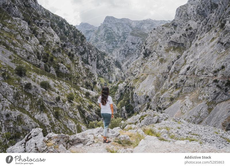 Woman enjoying freedom in mountains woman trekking hiker rocky traveler stone nature highland adventure spain slope asturias female scenery landscape peak