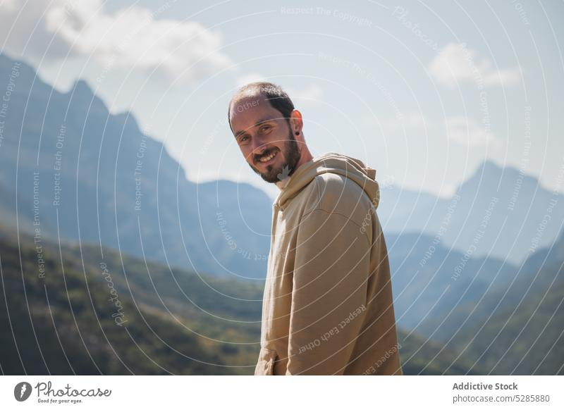 Unrecognizable man admiring mountainous valley traveler landscape admire tourist freedom sky town picturesque male enjoy vacation huesca city spain tourism