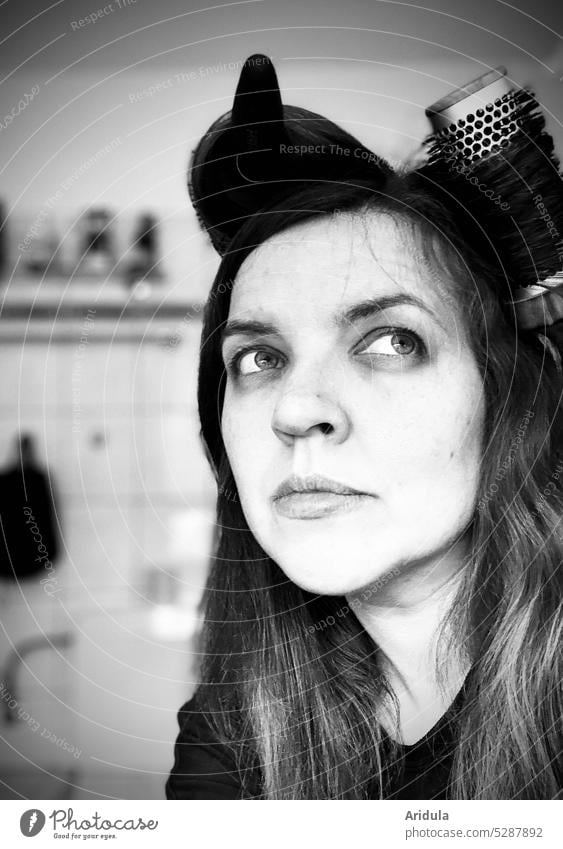 Portrait | woman sitting in bathroom with brushes in hair and looking up into corner portrait Woman Face Human being Looking eyes Hair and hairstyles