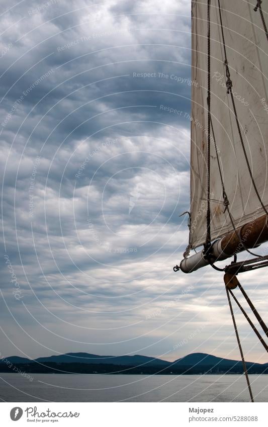 Beautiful landscape from a sailboat. Dramatic sky america bay of water blue boom calm water camden captain cloud coast coastline copy space dramatic sky