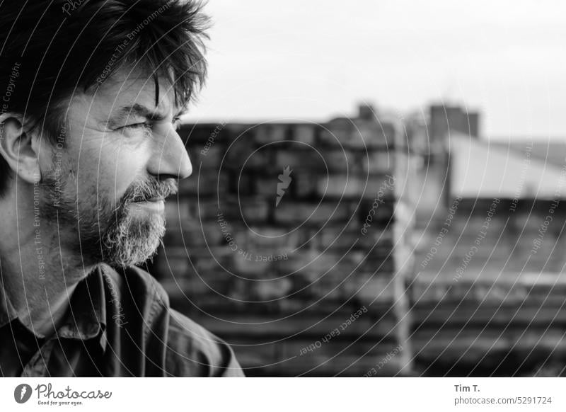 a man looks to the right Man Designer stubble b/w Berlin Prenzlauer Berg Downtown Town Capital city Black & white photo Exterior shot Day bnw Human being