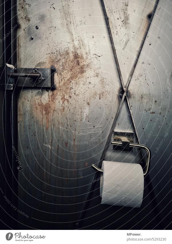 in the loo toilet paper Toilet paper roll Toilet paper holder Steel steel door Rust Industry Iron Coil Personal hygiene toilet roll Deserted Bathroom Clean