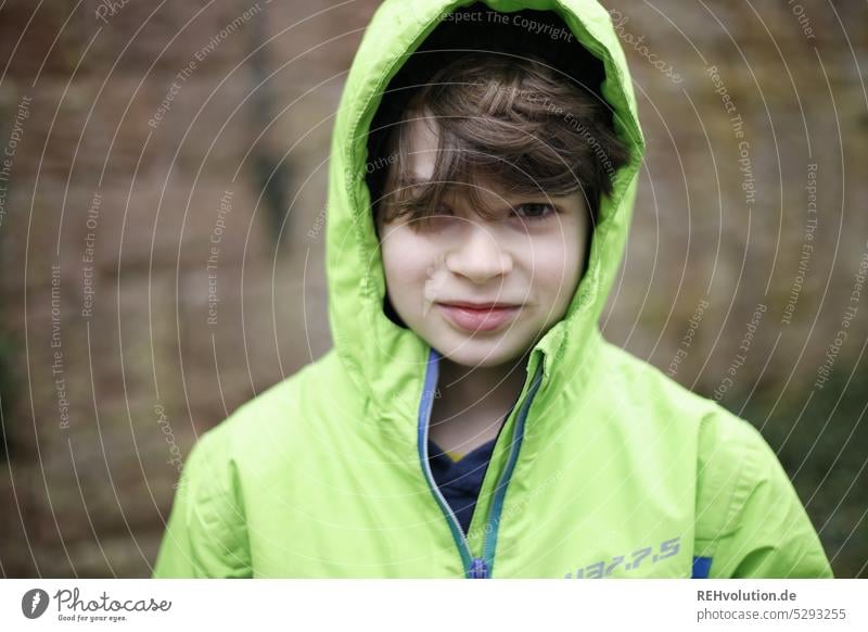 Child with hood Human being Boy (child) Infancy Environment Jacket Cap Smiling naturally Looking into the camera portrait Upper body Day Central perspective