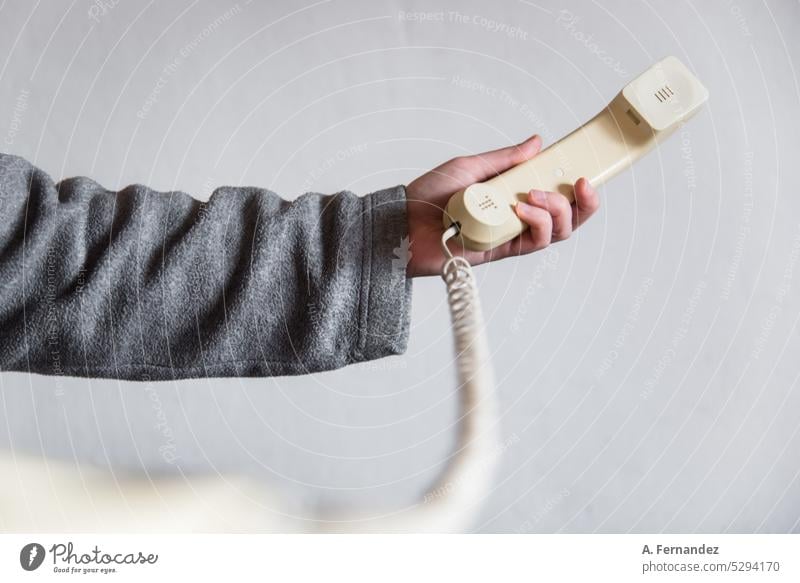 Woman holding the receiver of an old retro telephone device. concept of changes in ways of communication Telephone old phone Telephone connection