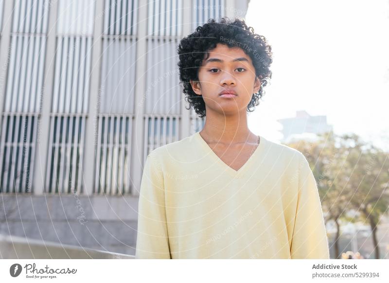 Thoughtful ethnic man with Afro hairstyle on street cool pensive thoughtful afro building modern urban trendy young serious male contemporary contemplate