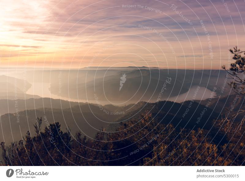 Sunset sky over hills and mountains sunset fog landscape nature valley bright highland sundown picturesque scenery evening scenic environment almatret catalonia