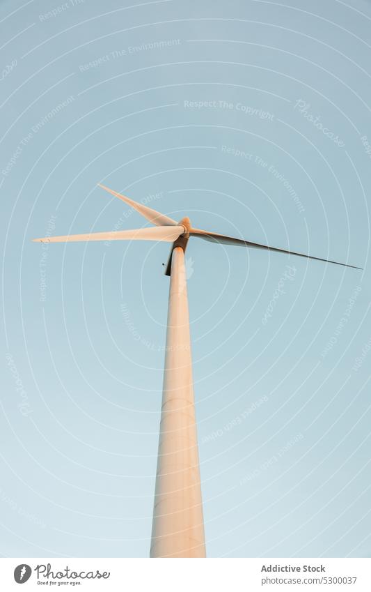 Windmill against cloudless blue sky windmill nature construction exterior power structure environment building industry reusable reclaimable spain daytime