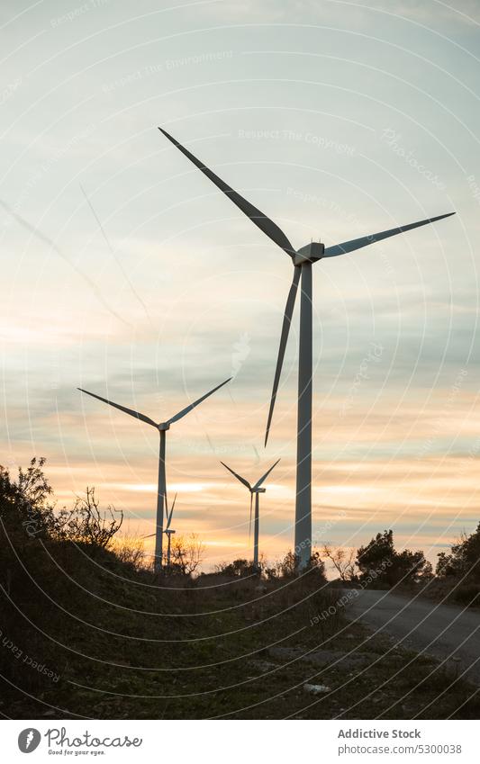 Windmill against cloudless blue sky windmill nature construction exterior power structure environment building industry reusable reclaimable spain daytime