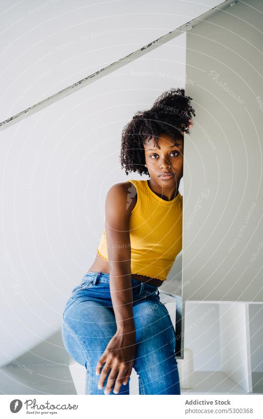 Black woman chilling on stairs step home railing casual style outfit female thoughtful african american young pensive staircase black relax rest content