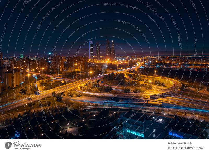 Cityscape with roads and skyscrapers in night cityscape building architecture sunset district sundown madrid cuatro torres four towers business area spain