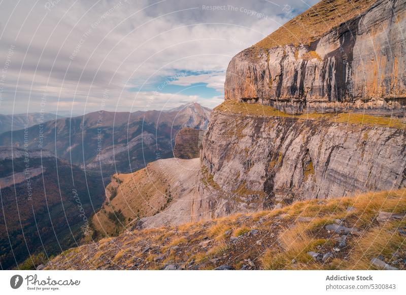 Rocky mountain slope under cloudy sky rocky nature rough uneven formation scenic natural ordesa pyrenees of huesca spain europe location wild environment