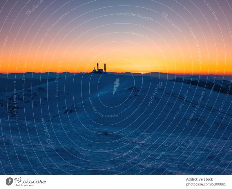Snowy mountains against sunset sky winter range landscape snow nature hill highland cold scenic sundown peak bola del mundo mountain spain evening picturesque