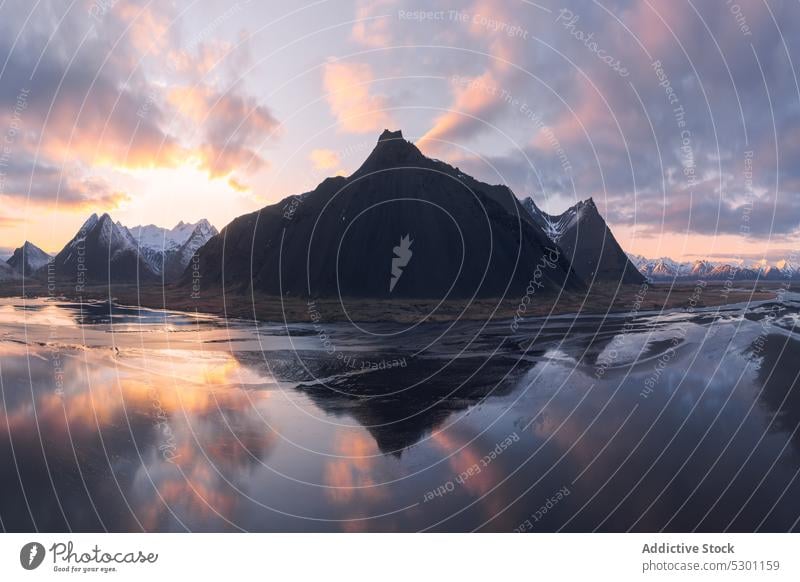 Mountainous terrain in winter day lake mountain snow frozen landscape sky sunset scenery sundown highland iceland vesturhorn mountain nature cloudy breathtaking