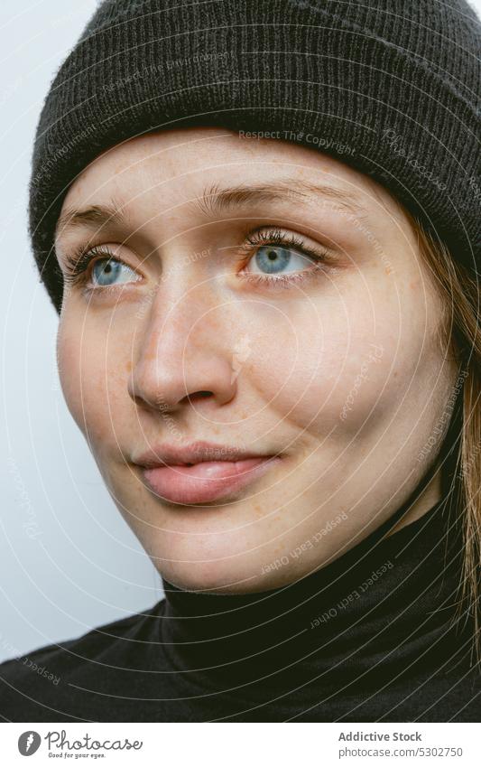 Calm woman in black turtleneck and beanie hat portrait model style natural female young appearance trendy fashion individuality charming accessory demonstrate