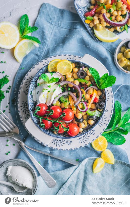 Healthy salad with tomatoes and lemon slices chickpea herb vegetable healthy delicious fresh plate diet tasty organic dish food meal nutrition vegetarian lunch