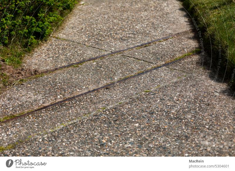 Railroad tracks of a style laid island railroad railway tracks rails Exterior shot decommissioned Narrow gauge railroad rusty