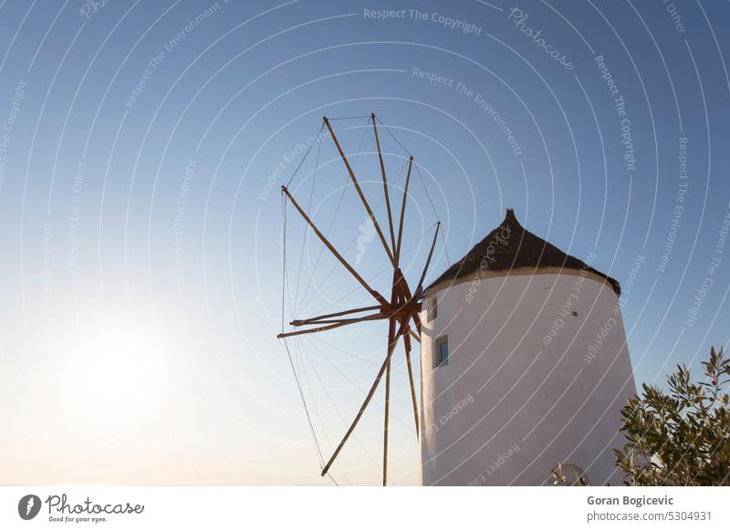 Traditional windmill in Oia on Santorini island, Greece white santorini sea summer greece architecture travel landscape building sky tourism village europe