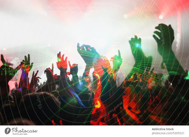 People on dance floor crowd nightclub illumination fun young light nightlife party music event festival concert celebration performance entertainment spotlight