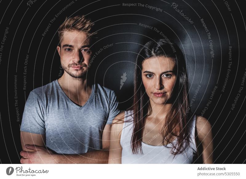 Couple posing in studio couple love together man woman relationship happy smiling casual young style tender care gentle cheerful joy pleasure glad standing