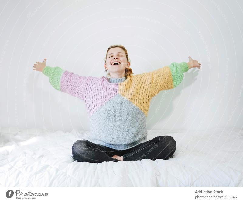 Smiling woman meditating on bed meditate lotus pose yoga smile glad zen home delight practice mindfulness calm female eyes closed relax peaceful padmasana