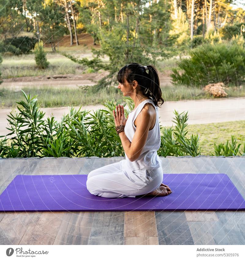 Calm woman meditating in yoga pose against plants namaste meditate calm practice nature hero virasana zen mindfulness spirit wellness pinamar buenos aires