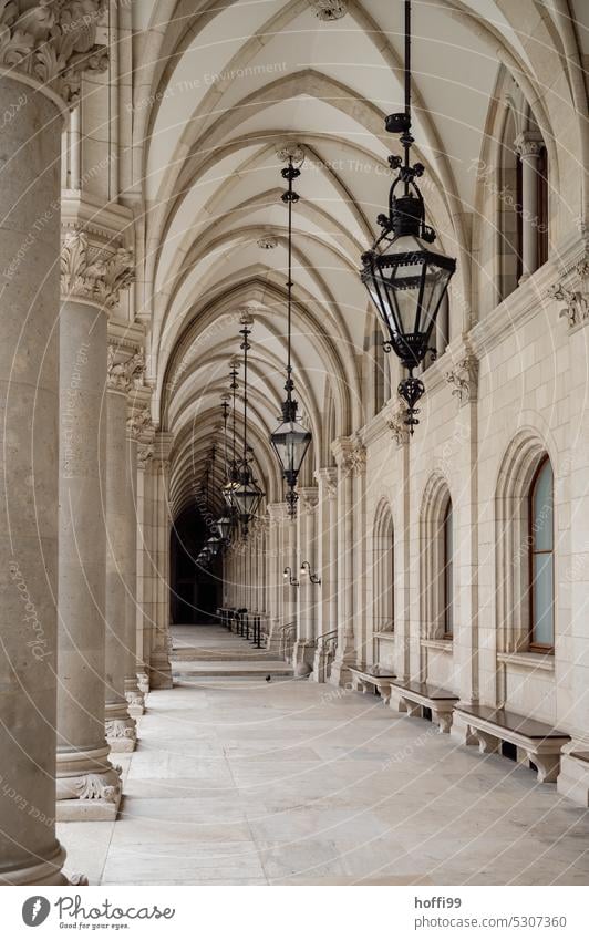 A place to linger - portico with benches in a historic building Säuzlengan Column series Seating Old town Historic Buildings historic old town Vienna