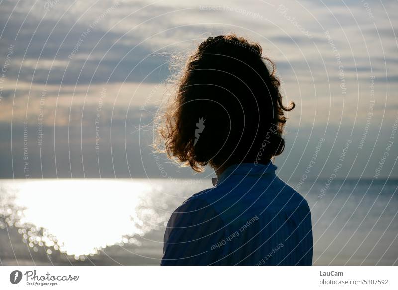 sea view Ocean Looking View into the distance Water look ahead move forward Woman Freedom sparkling water Horizon back view evening mood Sun Sunlight