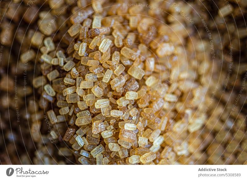 Detail of Brown textured sugar bowl brown candied cane caramel cook cooking crystal crystallized demerara eat eating food glucose ingredient kitchen meal