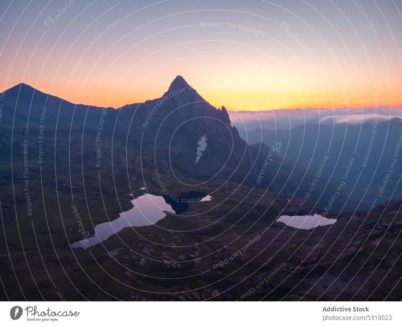 Scenic view of mountainous valley at sunset lake landscape ridge highland slope range nature sky fog majestic spectacular anayet pyrenees huesca spain scenery