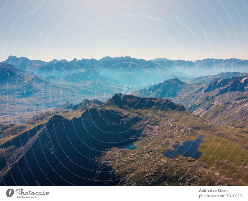 Majestic mountains with fog in daylight landscape lake valley range nature grass sky cloudless lawn anayet pyrenees huesca spain highland scenery picturesque