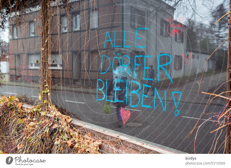 All villages stay. Writing on a shop window in the village of Keyenberg, which is threatened by lignite mining , Garzweiler 2 Soft coal mining Garzweiler2 RWE