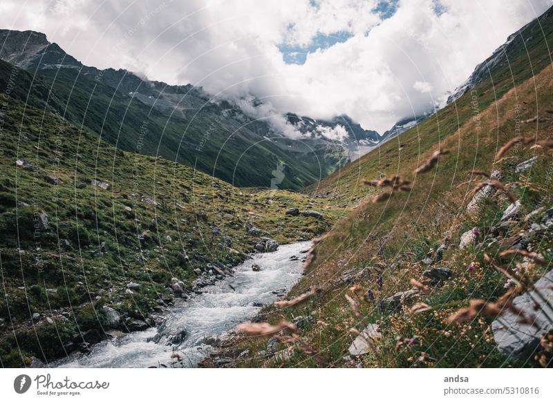 River in Switzerland High plain mountains Peak Snow High mountain region Rock Gray Waterfall Vantage point Freedom Nature Landscape abyss Cliff Mountain Alps