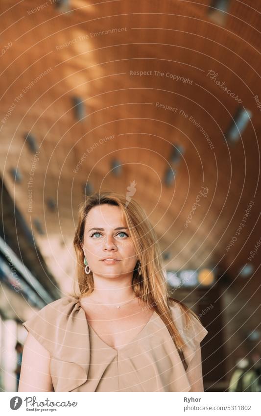 Portrait of young caucasian woman lady tourist traveler standing on the Dubai metro train station. High quality photo dubai copy space female lifestyle people