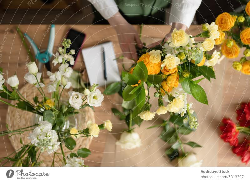 Woman working in florist shop woman flower bouquet arrange floristry store floral professional female job occupation plant fresh apron bloom small business