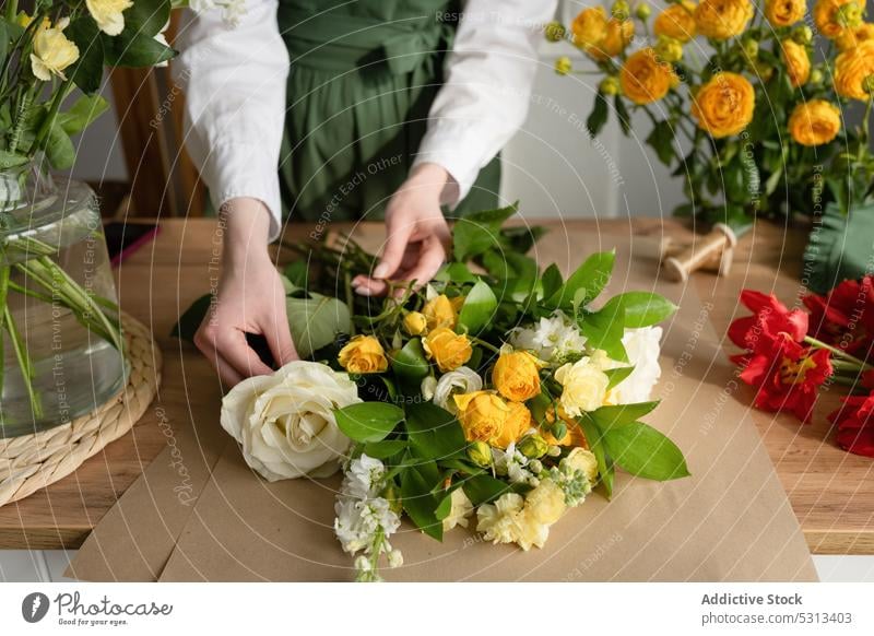 Woman working in florist shop woman flower bouquet arrange floristry store floral professional female job occupation plant fresh apron bloom small business